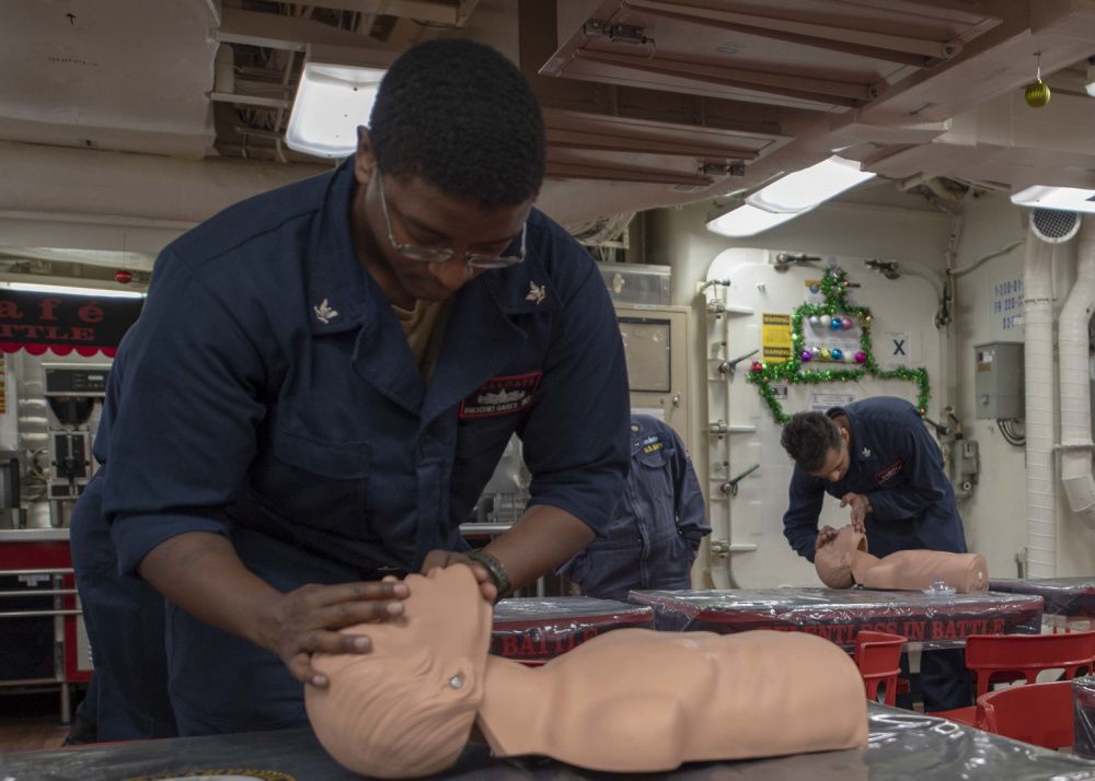Monroe native practices chest compressions aboard USS McCampbell